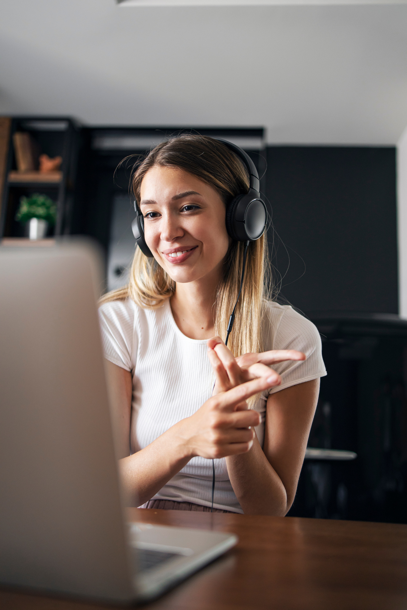 Attractive young teacher teaching online class